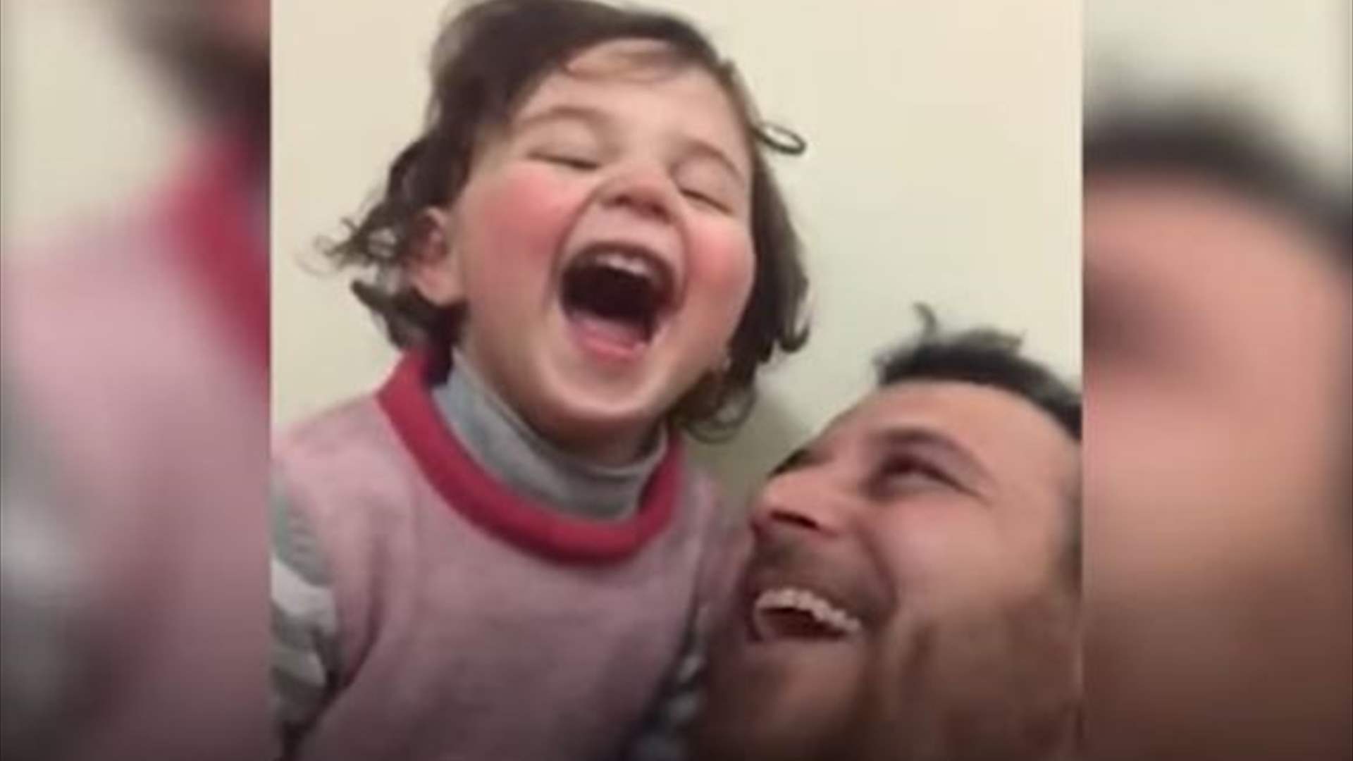 Social Media/ ما حقيقة فيديو الأب الذي يضحك طفلته أثناء القصف؟